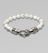A new look for the modern man, handsomely crafted with a sterling silver raven's head clasp and a string of howlite beads.Sterling silverLobster claspBracelet, 9 longAbout 3 diamImported