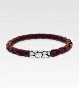A sterling silver button clasp offers contrasting color and texture to finely braided leather. Length, about 8 Imported
