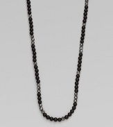 Matt onyx beads and faceted hematite in a smartly draped necklace.Matt onyx beadsHematite beadsBlack rhodium-plated sterling silver lobster clasp closureNecklace, 24 longImported