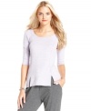 Two front slits add edge to this RACHEL Rachel Roy tee for a stylish spin on a wardrobe staple!