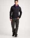 Knit from a sumptuously soft cotton fleece blend for a luxurious feel, a sporty long-sleeved half-zip pullover features allover ribbed-knit piecing for a modern look and subtle pop of texture.Mock neck collarHalf-zip frontTwo-way zip kangaroo pocketsSewn thumbholes at cuffs79% cotton/ 21% polyesterMachine washImported