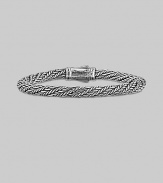 From the Kodiak Collection. A handsome, hand-woven herringbone braid of sterling silver with a bold carved clasp.6mm sterling silver braid Length, about 8½ Lobster clasp Made in USA