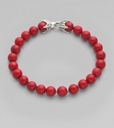 Smooth, polished coral beads are laced on a sterling silver chain. From the Spiritual Bead Collection Sterling silver Coral 8mm beads About 8½ long Lobster clasp Imported 