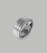 A ridged band of fine silver is finished with etched deisgns on the sides and inside of the band. From the Bedeg Collection Silver 0.35 wide Imported 
