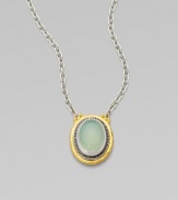 From the Gauntlet Collection. A smooth oval of pastel aqua chalcedony is elegantly framed in granulated sterling silver and hammered 24k gold, on a silver chain.Aqua chalcedonySterling silver and 24k yellow goldChain length, about 18Pendant length, about ¾Imported