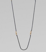 A simply chic design with 14k gold beads clusters on oxidized sterling silver link chain. 14k gold beadsOxidized sterling silverLength, about 40Spring ring closureMade in USA 