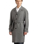 THE LOOKNotched lapelButton closureDual welt pocketsLong sleeves with tab accentsBelted waistVented back hemTHE FITAbout 40 from shoulder to hemTHE MATERIALWorsted woolFully linedCARE & ORIGINDry cleanMade in USA