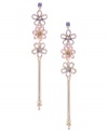 Sweet shoulder dusters. Betsey Johnson romanticizes the latest trend with the addition of three shimmering flower charms. Crafted in antique gold-plated mixed metal with pink, purple, and blue crystal accents. Approximate drop: 5-1/2 inches.