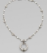 From the Dot Collection. An open circle pendant hangs from a sautoir link necklace, all of sterling silver in the distinctive dot design.Sterling silver Chain length, about 18 Pendant diameter, about 1¼ Lobster clasp Made in Bali