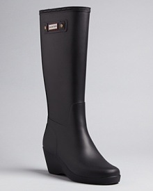 Stay high and dry in these wedge rain boots that add an elevated point of view to your favorite Hunter style. Stay high and dry in these wedge rain boots that add an elevated point of view to your favorite Hunter style.