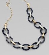 This chunky, tri-color design has a touch of whimsy with a anchor shaped spring ring closure. ResinPlastic12K goldplated brassLength, about 32Spring ring closureImported 
