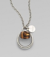 From the Bamboo Collection. Sleek sterling silver in a horsebit shape accented with bamboo on a link chain. Sterling silverBambooLength, about 19½ to 21½ adjustablePendant size, about 1Lobster clasp closureMade in Italy
