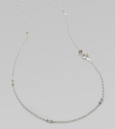From the Naga Collection. Long enough to double, this graceful sterling silver chain is dotted with pretty shield-shaped links and highlighted by a dramatic curved dragon.Sterling silverLength, about 36Lobster claspMade in Bali