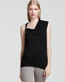 Artful and edgy, this Helmut Lang tee boasts both an asymmetric cowl neckline and asymmetric sleeves, exuding modern chic with both trend-right skinnies and micro minis. Artful and edgy, this Helmut Lang tee boasts both an asymmetric cowl neckline and asymmetric sleeves, exuding modern chic with both trend-right skinnies and micro minis.