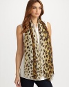 Fine silk woven enhanced with an exotic leopard print pattern.About 39 X 71 Dry clean Made in Italy 