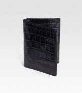 A mini-wallet that offers multiple functions, including four slots to hold cash and cards, plus a window for presentation of your subway/train pass. Ideal for the business exec or frequent commuter. Handmade in croco-embossed calfskin leather 3W X 4¼H Imported 