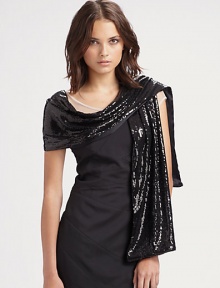 Dramatic evening stole with silk charmeuse lining. About 14 X 79 50% nylon/50% polyester 100% silk lining Dry clean Made in USA Dramatic evening stole with silk charmeuse lining. About 14 X 79 50% nylon/50% polyester 100% silk lining Dry clean Made in USA