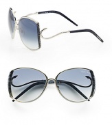 This sleek design boasts a ridged metal frame with hook detailed temples for a truely unique look. Available in shiny palladium blue with dark blue gradient lens. Hook detailed temples100% UV protectionMade in Italy 