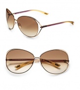 Round modified metal frames with open-end lens and tubular temples. Available in shiny rose gold with brown gradient lens.100% UV protection Made in Italy 