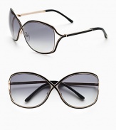Metal crossover butterfly shaped frame enhanced with enamel insert. Available in shiny rose gold with black enamel and grey gradient lens.100% UV protection Made in Italy