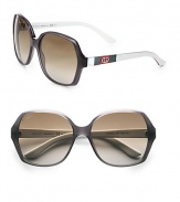 Signature stripes and double-G logos adorn the temples of this classic style. Available in grey frames with brown/grey gradient lens.Logo temples100% UV protectionMade in Italy