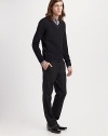 A new look for collegiate cool is shaped in extra-fine wool yarns with a v-neckline and contrast trim. V-neck 97% wool/3 %spandex Dry clean Imported 