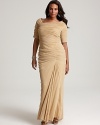 An elegant short-sleeved silhouette lends flattering appeal to this red carpet-worthy gown from Tadashi Shoji Plus.