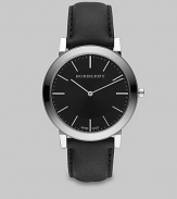A super-slim black dial with sapphire crystal detail on a smooth leather strap. Round bezel Quartz movement Water resistant to 3 ATM Stainless steel case: 40mm (1.57) Leather strap: 20mm (0.79) Made in Switzerland 
