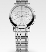 A polished, silvertone design crafted with precision Swiss detail and three-eye chronograph detail on an engraved check face. Water resistant to 5 ATM Date function at 4 o'clock Quartz movement Second hand Case, about 40mm Strap, about 20mm Made in Switzerland