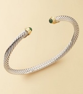 From The Cable Kids Collection. A charming sterling silver cable with emerald end caps set in 18k gold. Emerald Sterling silver and 18k yellow gold Cable, 4mm Diameter, about 2 Made in USA