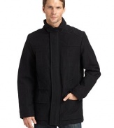 THE LOOKStand collar with concealed, zip-in hoodThroat tabZip front with snap storm flapDrawcord waistSlash pockets at chest; flap patch pockets at waistSnap cuffsVented back hemTHE FITAbout 28 from shoulder to hemTHE MATERIALShell: 50% polyester/43% cotton/7% nylonFill: polyesterFully linedCARE & ORIGINDry clean Imported