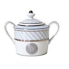 Carefully rendered in a style reminiscent of neoclassic trompe l'oeil-a French term for artwork that depicts optical illusions-a captivating geometric rosette motif traverses this elegant porcelain sugar bowl from Bernardaud. Delicate shades of ice blue, mother-of-pearl and gray are enhanced by fine platinum details. Carefully rendered in a style reminiscent of neoclassic trompe l'oeil-a French term for artwork that depicts optical illusions-a captivating geometric rosette motif traverses this elegant porcelain sugar bowl from Bernardaud. Delicate shades of ice blue, mother-of-pearl and gray are enhanced by fine platinum details.