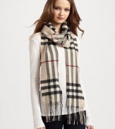 Luxurious and soft cashmere in a classic oversized check pattern. Fringe trim About 6 X 79 Cashmere; dry clean Made in Great Britain