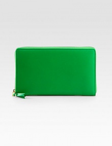 A sleek, stylish way to keep your essentials organized, crafted from sumptuously-smooth leather.Zip-around closureCenter zip compartmentTwo inside open pocketsFourteen credit card slotsGreen wallet: green interiorBlue wallet: blue interiorLeather lining8½W X 5H X 1DImported A sleek, stylish way to keep your essentials organized, crafted from sumptuously-smooth leather.Zip-around closureCenter zip compartmentTwo inside open pocketsFourteen credit card slotsGreen wallet: green interiorBlue wallet: blue interiorLeather lining8½W X 5H X 1DImported