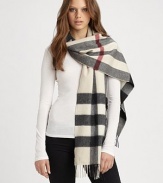 A beautiful cashmere style with an signature print and fringe details. CashmereAbout 14 X 79Dry cleanImported 