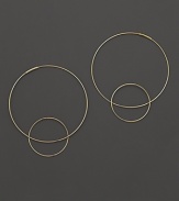 Like magic, smaller hoops balance on 14K gold counterparts.