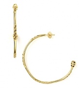 Do the delicate thing and swap your everyday studs for Melinda Maria's airy gold hoops. Hearts will melt.