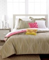 A wavy stripe pattern on a calming tan backdrop offers a relaxed design for your space in this Aurora duvet cover set. Two decorative pillows add pops of pink and yellow for a stand-out look. Reverses to solid.