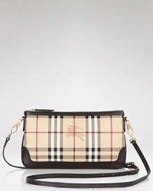 Wallet by day, clutch by night, this chic little Burberry wristlet is elegantly versatile. Wallet by day, clutch by night, this chic little Burberry wristlet is elegantly versatile.
