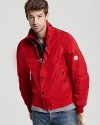 Trim and sporty, this handsome jacket protects your from the elements and introduces a bold pop of color into your cold-weather wardrobe.