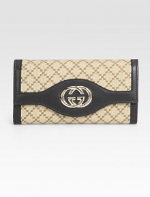 Signature logo jacquard in a foldover silhouette, finished with leather trim and GG hardware.Magnetic snap flap pocketCenter zip pocketTwo inner compartmentsThirteen credit card slotsFully lined7½W X 4H X 1¼DMade in Italy Signature logo jacquard in a foldover silhouette, finished with leather trim and GG hardware.Magnetic snap flap pocketCenter zip pocketTwo inner compartmentsThirteen credit card slotsFully lined7½W X 4H X 1¼DMade in Italy