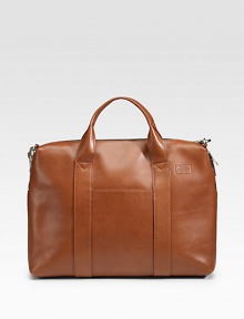 Smooth, pliable leather with a soft hand that only improves with age. Zip closure Top handles Interior compartment with snap closure Adjustable, removable shoulder strap Exterior, interior organizing pockets 16W X 11¾H X 2¾D Imported Smooth, pliable leather with a soft hand that only improves with age. Zip closure Top handles Interior compartment with snap closure Adjustable, removable shoulder strap Exterior, interior organizing pockets 16W X 11¾H X 2¾D Imported