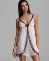 This fun and flirty chemise is a pleaser, with its polka dot bust and bow.