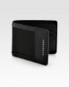 Carry your cards and cash in style with this masculine, yet modern hipfold design rendered in a sturdy nylon with signature leather trim and detail.One billfold compartmentSix card slots94% polyamide/6% acrylic3W x 4HImported