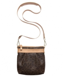 A relaxed crossbody silhouette is dressed up in eye-catching signature lettering and soft leather trim. This take-anywhere Calvin Klein design is perfect for an afternoon in town or a weekend away. And the surprisingly roomy interior fits wallet, keys, phone and makeup purse with ease. A relaxed crossbody silhouette is dressed up in eye-catching signature lettering and soft leather trim. This take-anywhere Calvin Klein design is perfect for an afternoon in town or a weekend away. And the surprisingly roomy interior fits wallet, keys, phone and makeup purse with ease.