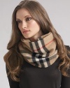 Ultra-soft cashmere snood in large oversized check can be accessorized with outerwear or worn on its own. One size fits most Cashmere; dry clean Imported