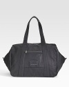 An oversized carryall ideal for a daytrip or an overnight jaunt, constructed in coated canvas and destined to last for years to come. Zip closure Covered logo plate Adjustable cross-body strap, 50 long Exterior zip pocket Interior slip pocket Fully lined 19¾W X 12H X 12D Imported 