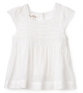 A light, effortlessly cute butterfly sleeve dress adorned with rolled seams along the top, lace trim and a ruffled skirt.