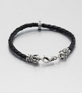 Thin braided leather bracelet is interrupted by a sterling silver crown for a refined, luxurious look, accented with a signature logo detail of sterling silver.Sterling silverLeatherAbout 9 longLobster claspMade in USA