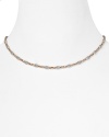 Officina Bernadia's rose gold and platinum necklace is a tasteful jewelry box update. Try wearing the understated style with sheer knits to showcase it's delicate shimmer.